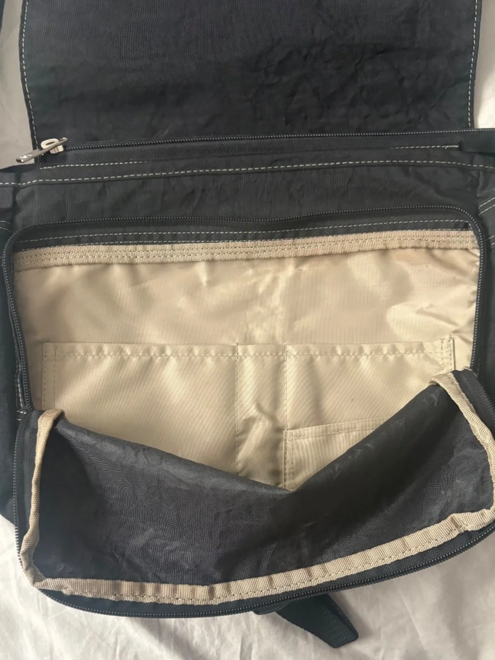 Inside NY unisex messenger bag.